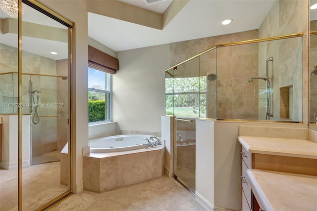 bathroom with separate shower and tub, vanity, and tile patterned floors