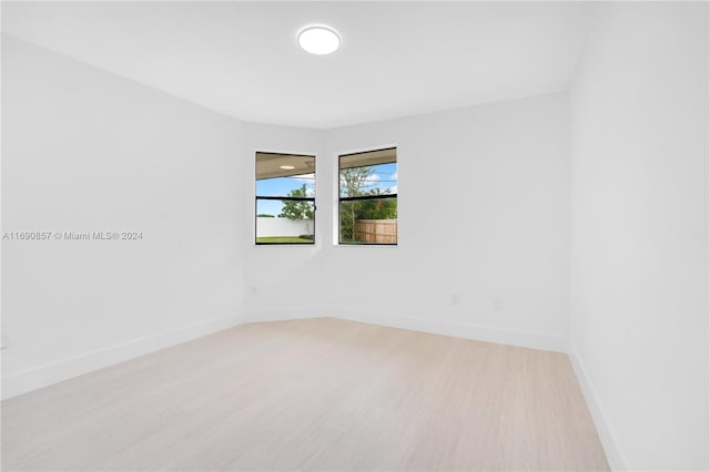 empty room with light wood-type flooring