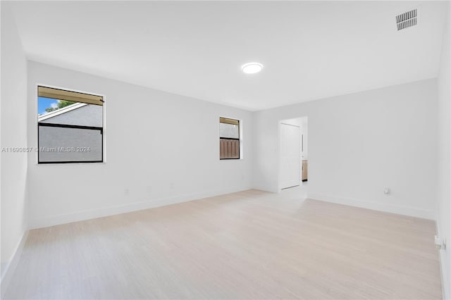 spare room with light wood-type flooring