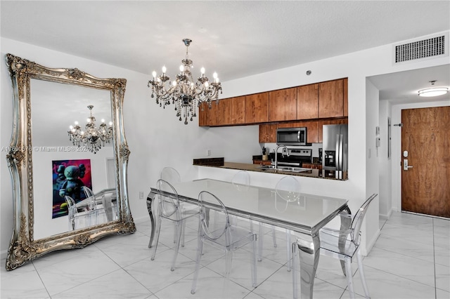 dining space featuring sink and a notable chandelier