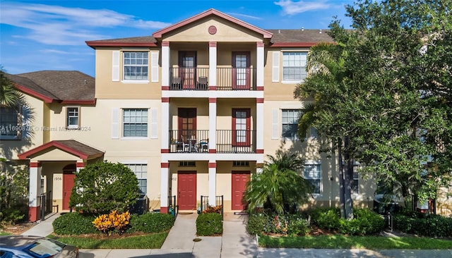 view of front of house with a balcony