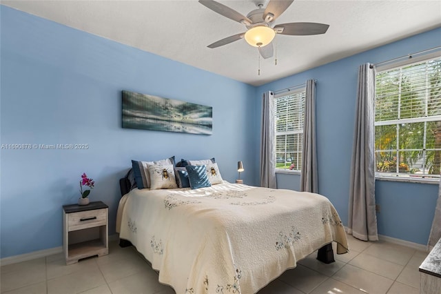 bedroom featuring ceiling fan and light tile patterned floors