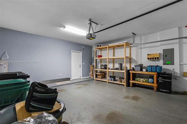 garage with electric panel and a garage door opener