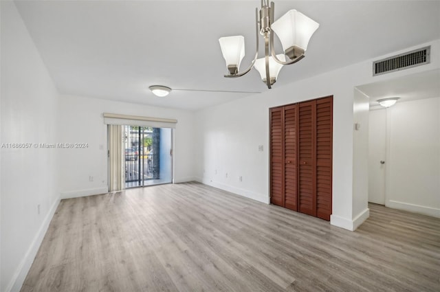 empty room with light hardwood / wood-style flooring