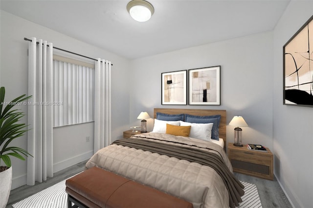 bedroom with hardwood / wood-style floors