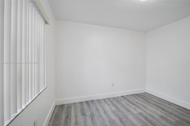 spare room featuring light hardwood / wood-style flooring