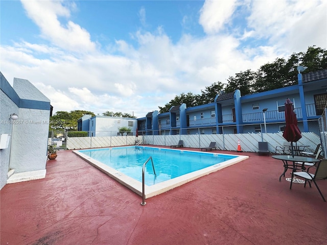 view of swimming pool featuring a patio