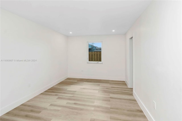 unfurnished room with light hardwood / wood-style floors