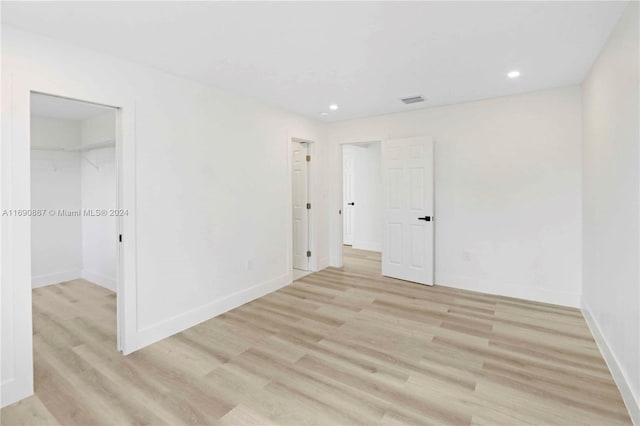 empty room with light hardwood / wood-style floors