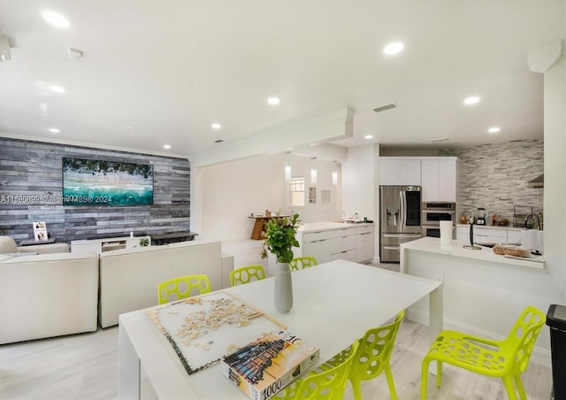 dining area featuring light hardwood / wood-style floors