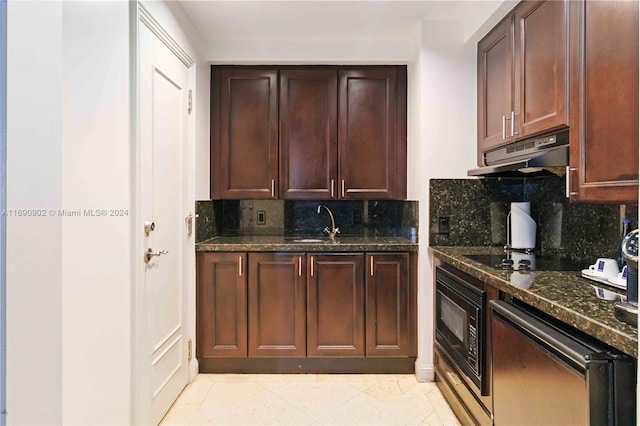 kitchen featuring tasteful backsplash, dark stone counters, sink, black appliances, and light tile patterned floors