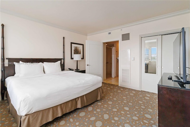 bedroom with crown molding and a closet