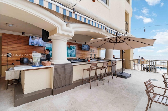 view of patio with an outdoor bar