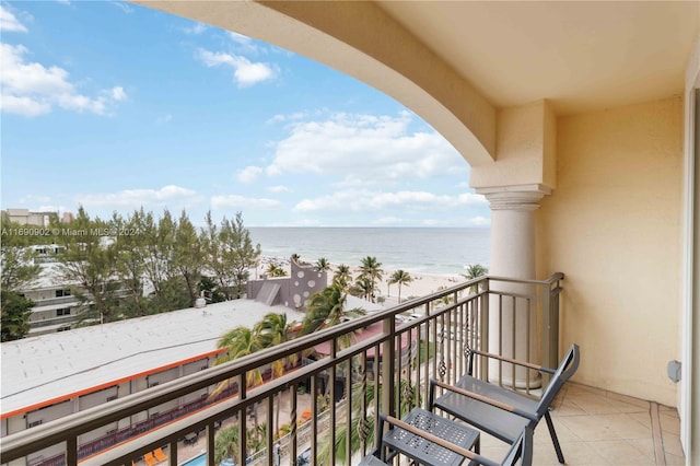 balcony with a view of the beach and a water view