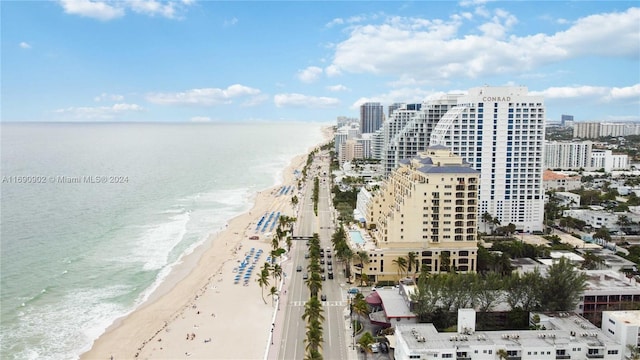 bird's eye view with a water view and a view of the beach