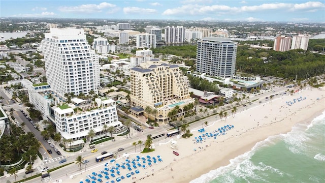 bird's eye view featuring a view of the beach and a water view