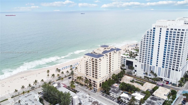 aerial view featuring a water view and a view of the beach