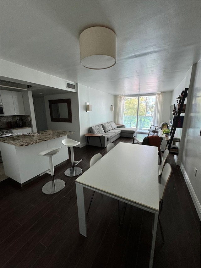 living room featuring dark wood-type flooring