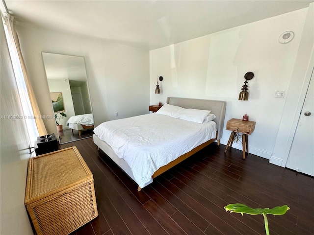 bedroom featuring dark hardwood / wood-style floors