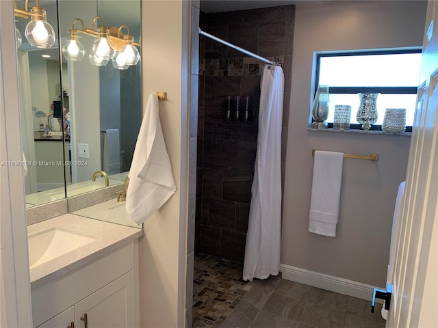 bathroom featuring vanity and a shower with shower curtain