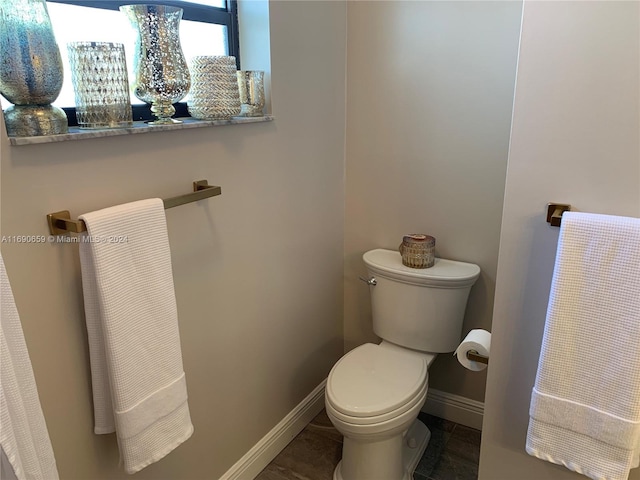 bathroom featuring tile patterned flooring and toilet