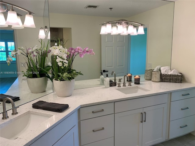 bathroom featuring vanity and tile patterned flooring