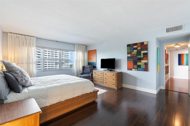 bedroom featuring dark hardwood / wood-style flooring