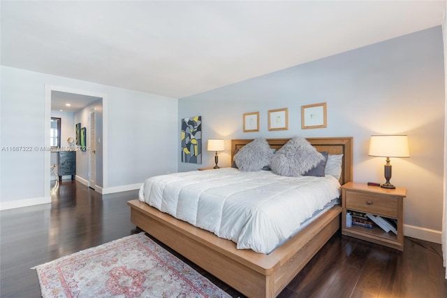 bedroom with dark hardwood / wood-style flooring