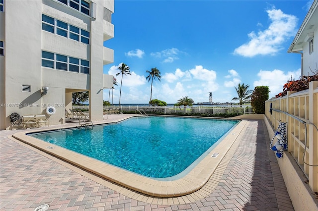 view of swimming pool with a patio