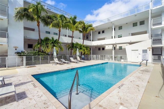 view of swimming pool featuring a patio