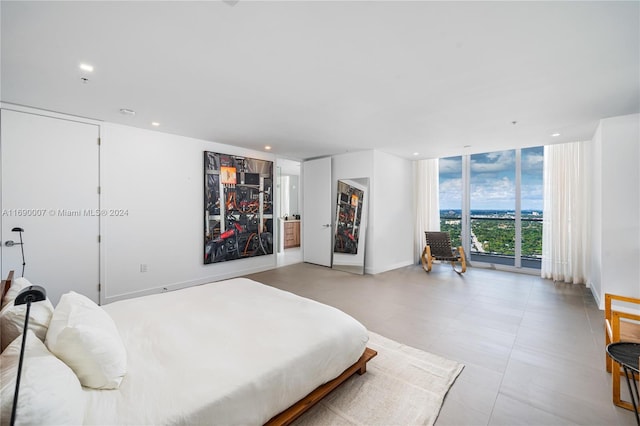 bedroom featuring a wall of windows