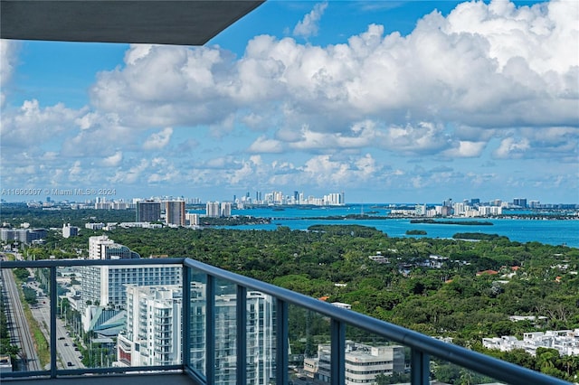 balcony featuring a water view