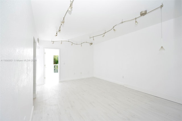 spare room with light hardwood / wood-style floors