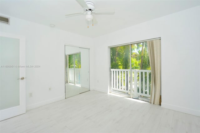 unfurnished room with light hardwood / wood-style flooring and ceiling fan