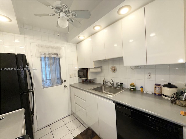 kitchen featuring decorative backsplash, black appliances, sink, ceiling fan, and white cabinetry