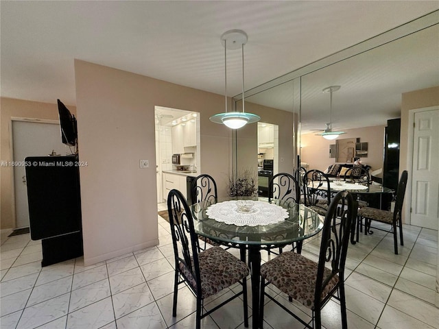 dining room featuring ceiling fan