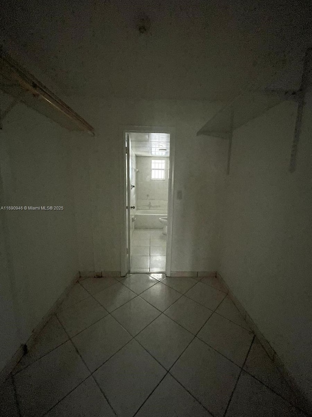 spare room with light tile patterned floors