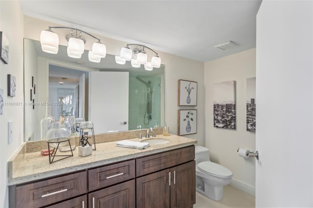 bathroom with walk in shower, vanity, and toilet