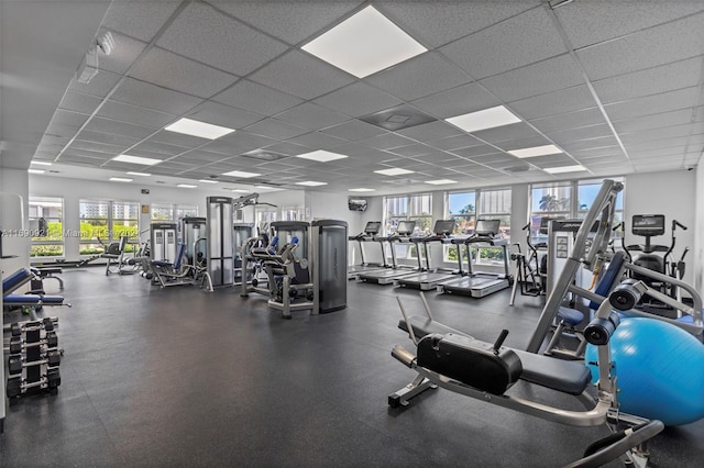 workout area featuring a drop ceiling