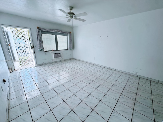 tiled empty room with a wall unit AC and ceiling fan