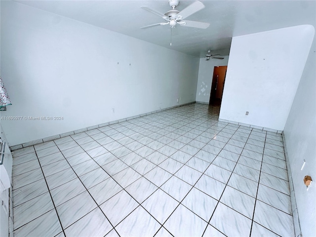 unfurnished room with ceiling fan