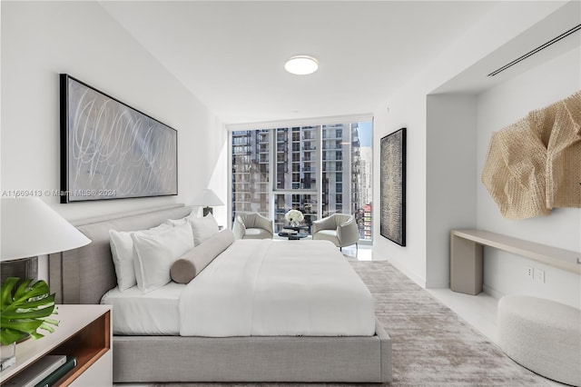 bedroom featuring a wall of windows