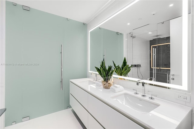 bathroom with vanity and a shower with door