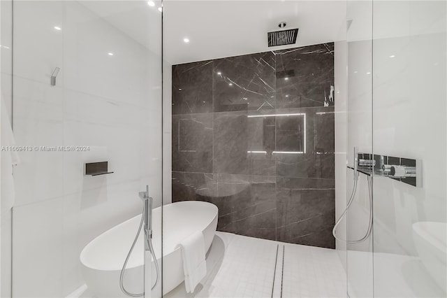 bathroom featuring tile patterned floors and separate shower and tub