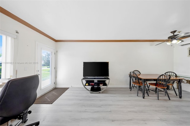 dining area featuring crown molding, a wall mounted AC, ceiling fan, and light hardwood / wood-style flooring