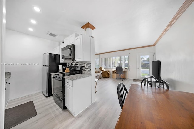 kitchen with white cabinetry, tasteful backsplash, light stone countertops, black appliances, and light wood-type flooring