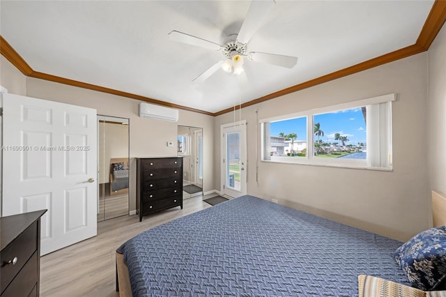 bedroom featuring crown molding, an AC wall unit, light wood-type flooring, and ceiling fan