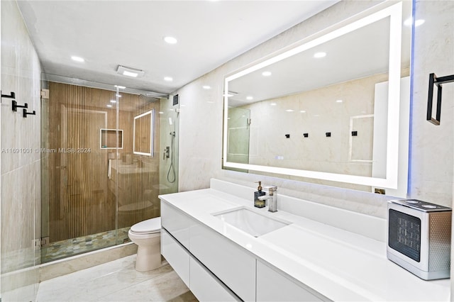 bathroom featuring walk in shower, vanity, and toilet