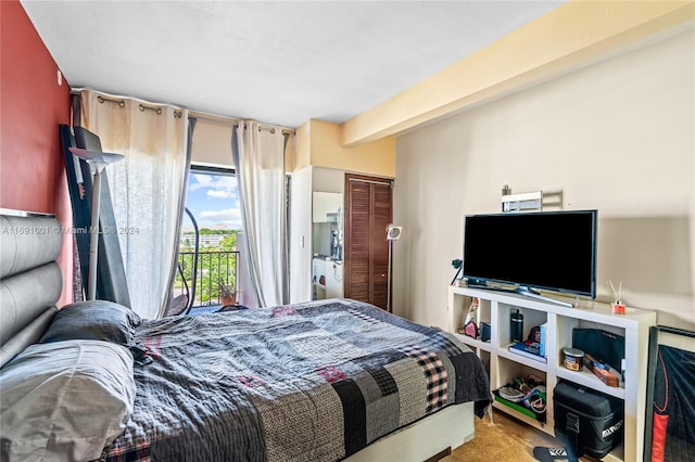 bedroom featuring beamed ceiling, carpet flooring, and access to exterior