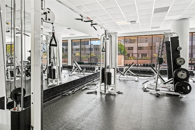 workout area featuring a paneled ceiling